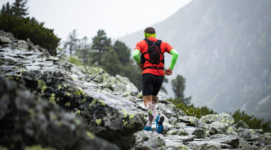 A trail runner carries his nutrition in a running pack