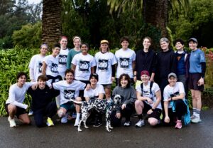 Cal Calamia and the Non-Binary Run Club runners pose for a photo