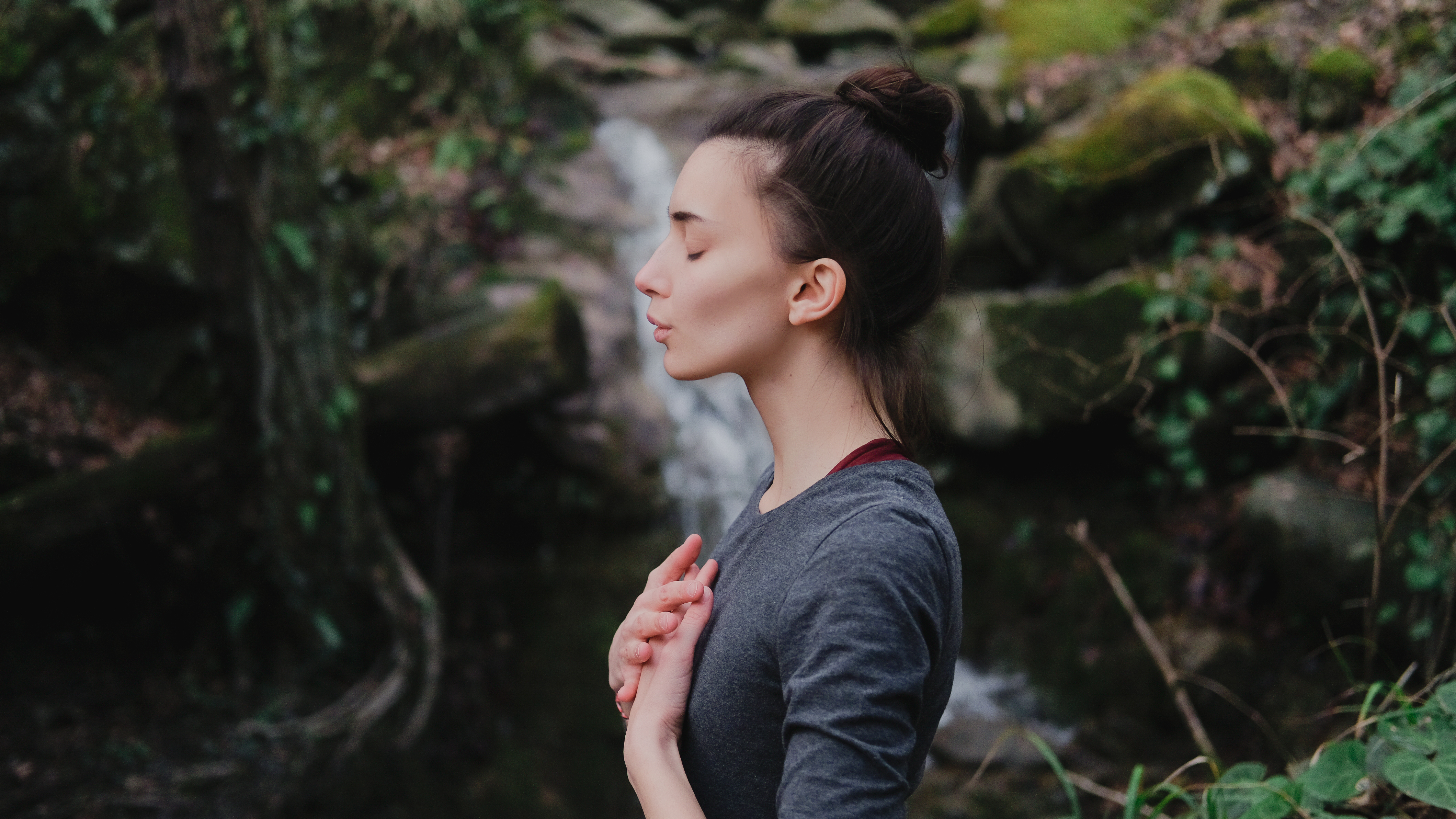 A woman does a breathing technique during her run