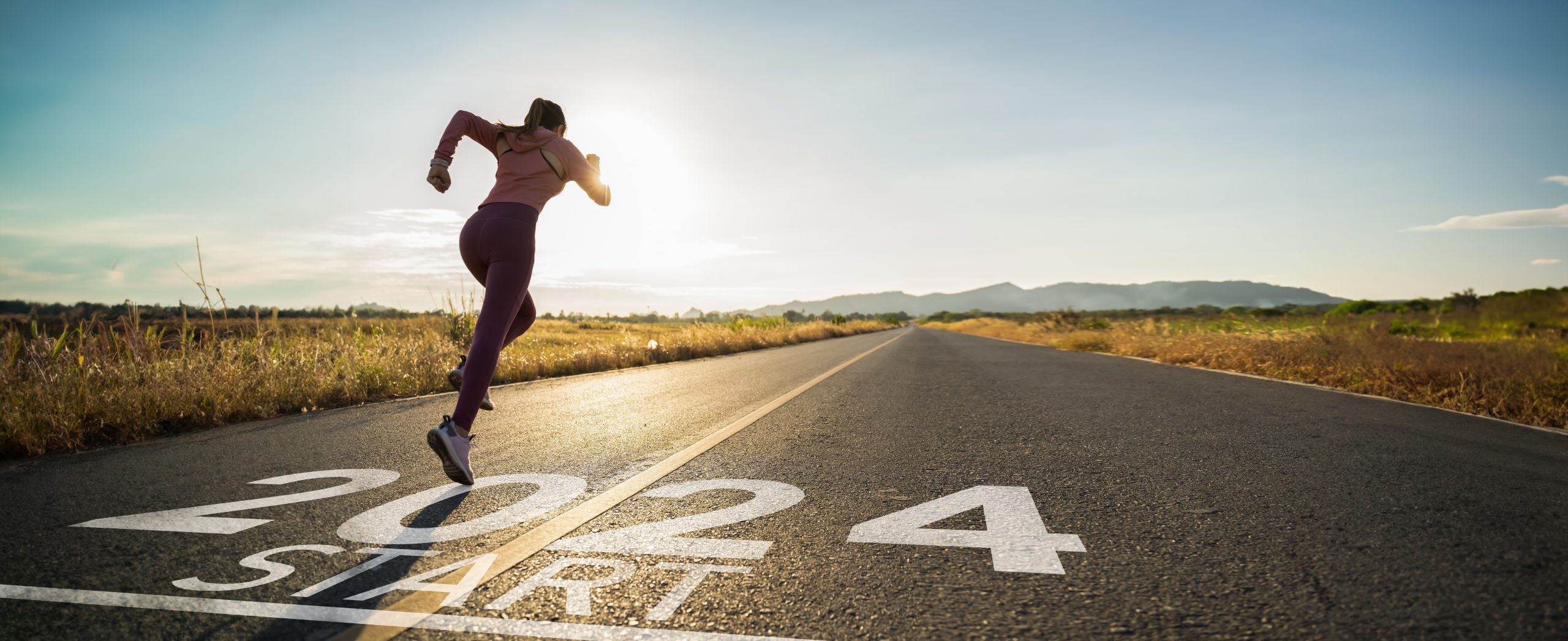 A runner with new year goals is running into 2024