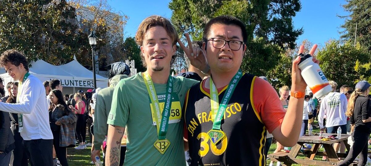 Autistic runner Tommy He and the SF Marathon's NB+ division winner Cal Calamia at the Berkeley Half Marathon