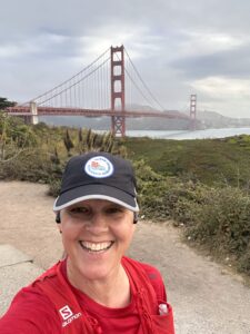 Lucie Nestrasilova runing past the Golden Gate Bridge