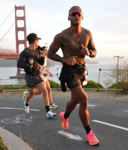 Jeremiah Maestre runs with the Golden Gate Bridge in the background