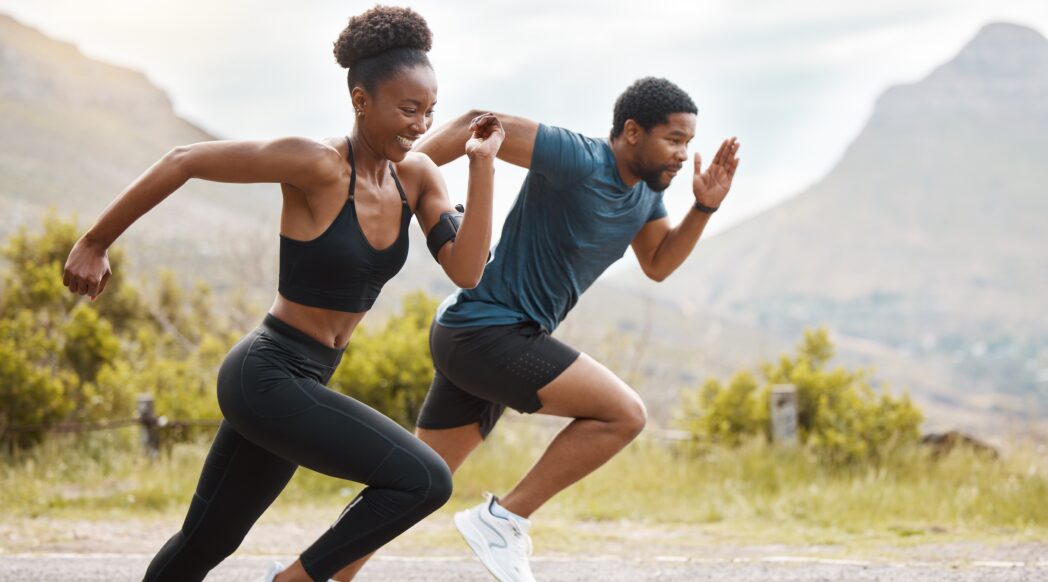 A pair of African American runners do a speed session and beginner plyometrics