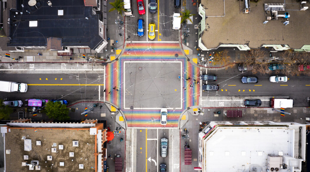 An overhead view of one of the Castro neighborhood's intersection with rainbow pedestrian crossings