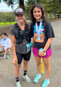 Anna Sandhu at the finish of the San Francisco Marathon with a fellow runer