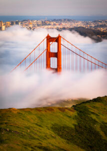 The Golden Gate Bridge pokes out up above the fog